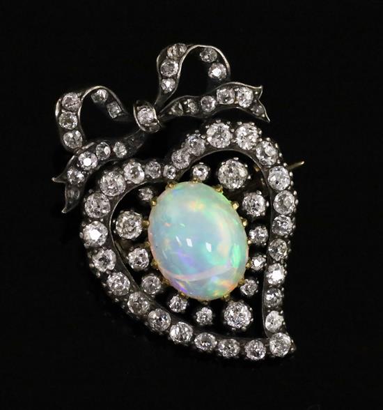 A Victorian gold and silver, white opal and diamond heart shaped brooch, 30mm.